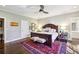 Spacious main bedroom features a king bed, wood floors, and stylish decor, creating a relaxing retreat at 1299 W Wesley Nw Rd, Atlanta, GA 30327