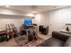 A finished basement office with guitars, music stand, and desk creates a versatile space for work or hobbies at 1299 W Wesley Nw Rd, Atlanta, GA 30327