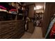 Walk-in closet with custom shelving, hanging rods, and drawers for organized storage and convenience at 1299 W Wesley Nw Rd, Atlanta, GA 30327