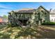 Green home featuring a wooden deck, luscious lawn, and ample space for outdoor enjoyment at 2111 Democracy Dr, Buford, GA 30519