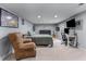 Finished basement with entertainment setup, cozy seating, and ample space at 2111 Democracy Dr, Buford, GA 30519