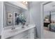 Elegant bathroom featuring double sinks, a large mirror, and modern fixtures at 2111 Democracy Dr, Buford, GA 30519