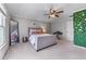 Bright bedroom features a large mirror, accent wall and plenty of room at 2111 Democracy Dr, Buford, GA 30519