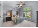 Bedroom featuring four-poster bed, large window, and neutral décor at 2111 Democracy Dr, Buford, GA 30519