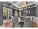 Dining area featuring natural light, a coffered ceiling and beautiful hardwood floors at 2111 Democracy Dr, Buford, GA 30519