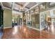 Stylish foyer featuring beautiful hardwood floors, coffered ceilings, and decorative details at 2111 Democracy Dr, Buford, GA 30519