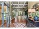 Grand foyer showcasing coffered ceilings, hardwood floors, decorative mirrors, and an open floor plan at 2111 Democracy Dr, Buford, GA 30519