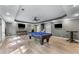 Bright and spacious game room features a billiards table, recessed lights, and backyard access at 2111 Democracy Dr, Buford, GA 30519