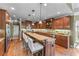 Gourmet kitchen with granite countertops, island seating, and stainless steel appliances at 2111 Democracy Dr, Buford, GA 30519