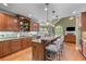 Gourmet kitchen featuring granite counters, stainless steel appliances, and eat-in bar at 2111 Democracy Dr, Buford, GA 30519
