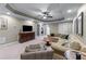 Expansive living room features recessed lighting, neutral carpet, and an easy access to the wet bar at 2111 Democracy Dr, Buford, GA 30519
