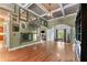 Elegant living room with coffered ceilings, hardwood floors, and large windows offering natural light at 2111 Democracy Dr, Buford, GA 30519