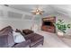 Cozy living room with plush seating, built-in shelving, and a ceiling fan at 2111 Democracy Dr, Buford, GA 30519