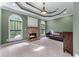 Inviting living room with a stone fireplace, trey ceiling, and abundant natural light at 2111 Democracy Dr, Buford, GA 30519