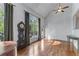 Bright room featuring high ceilings, hardwood floors, and large windows with a view to the outside deck at 2111 Democracy Dr, Buford, GA 30519