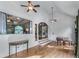 Bright living room featuring hardwood floors, high ceilings, and a beautiful piano at 2111 Democracy Dr, Buford, GA 30519