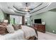 Spacious main bedroom features trey ceilings, with a view of the fireplace in the sitting area at 2111 Democracy Dr, Buford, GA 30519