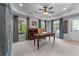 Bright office space with multiple windows, neutral tones, and a door to the outside at 2111 Democracy Dr, Buford, GA 30519