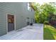 View of the patio area, with an additional entrance into the home and wrought iron fence at 2111 Democracy Dr, Buford, GA 30519