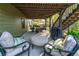 Covered patio with seating area and grill, perfect for outdoor gatherings at 2111 Democracy Dr, Buford, GA 30519