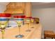 Wet bar area features wooden cabinetry, counter top, and colorful martini glasses at 436 Westlake Nw Dr, Marietta, GA 30064