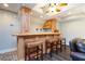 Finished basement with a rustic bar area including bar stools and a decorative wood design at 436 Westlake Nw Dr, Marietta, GA 30064