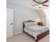 Bedroom features a dark wood bed frame, decorative bedding, ceiling fan and a small nightstand at 436 Westlake Nw Dr, Marietta, GA 30064