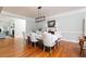 Dining area featuring hardwood floors, a modern chandelier, and elegant table setting for formal dining at 436 Westlake Nw Dr, Marietta, GA 30064
