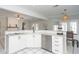 Bright kitchen with white cabinets, stainless steel appliances, and eat-in area at 436 Westlake Nw Dr, Marietta, GA 30064