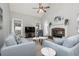 Comfortable living room featuring a fireplace, vaulted ceilings, and abundant natural light from the windows at 436 Westlake Nw Dr, Marietta, GA 30064