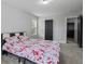 Bedroom with neutral colored walls and carpet, with a bed facing the entry door at 1205 Campbell Ridge Ln, Lawrenceville, GA 30045