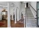 Inviting foyer with hardwood floors, arched doorways, staircase and elegant decor creates a grand entrance at 1205 Campbell Ridge Ln, Lawrenceville, GA 30045