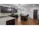 Beautiful kitchen with granite countertops, stainless steel appliances, and dark cabinets at 1205 Campbell Ridge Ln, Lawrenceville, GA 30045