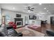 Open-concept living space with hardwood floors, fireplace, eat-in kitchen, and ample natural light at 1205 Campbell Ridge Ln, Lawrenceville, GA 30045