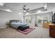 Spacious main bedroom with tray ceiling, a ceiling fan, and large windows offering plenty of natural light at 1205 Campbell Ridge Ln, Lawrenceville, GA 30045