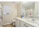 Bathroom with double sink vanity, a toilet, a mirror and shower at 1520 Ethans Way, Mcdonough, GA 30252