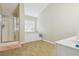 Bathroom with a walk in shower, garden tub, single sink vanity and a window at 1520 Ethans Way, Mcdonough, GA 30252