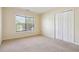 Bright bedroom featuring neutral walls, carpeted floor and a large window with natural light at 1520 Ethans Way, Mcdonough, GA 30252