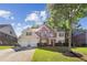 Charming two-story home with a well-manicured lawn, two-car garage, and beautiful landscaping at 1520 Ethans Way, Mcdonough, GA 30252