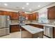 Beautiful kitchen boasts stainless steel appliances, tile backsplash, and a center island at 1520 Ethans Way, Mcdonough, GA 30252