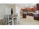 Kitchen and breakfast nook includes stainless steel appliances, tile floors, and a center island at 1520 Ethans Way, Mcdonough, GA 30252