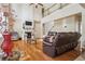 Spacious living room with fireplace, soaring ceiling and wood floors offers plenty of natural light at 1520 Ethans Way, Mcdonough, GA 30252