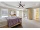 Main bedroom with trey ceilings, carpet flooring, and large closet at 1520 Ethans Way, Mcdonough, GA 30252
