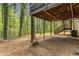 View of the backyard beneath a wooden deck and stairway at 204 Holly Creek Way, Woodstock, GA 30188