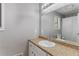 Well-lit bathroom features a large mirror above a granite vanity and a shower-tub combo with a white shower curtain at 204 Holly Creek Way, Woodstock, GA 30188