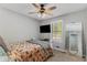 Bright bedroom with ceiling fan, carpet, and a view of the backyard at 204 Holly Creek Way, Woodstock, GA 30188