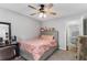Comfortable bedroom with a ceiling fan and plush carpeting, with two beds for sharing at 204 Holly Creek Way, Woodstock, GA 30188
