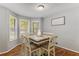Cozy dining room with hardwood floors and lots of natural light at 204 Holly Creek Way, Woodstock, GA 30188