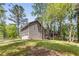 Exterior of home with two-car garage and rear wood deck at 204 Holly Creek Way, Woodstock, GA 30188