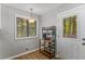 Bright nook featuring laminate floors, natural light, and door access to the exterior at 204 Holly Creek Way, Woodstock, GA 30188